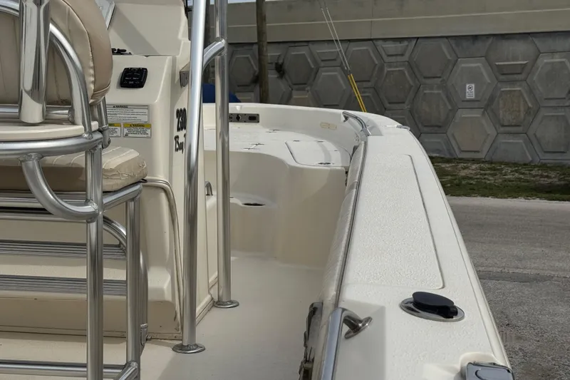 Slide: The Image of 2015 SeaChaser 23LX boat interior with seating and railing details. - 12