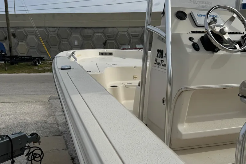 Slide: The Image of 2015 SeaChaser 23LX boat, side view of deck and steering console. - 14