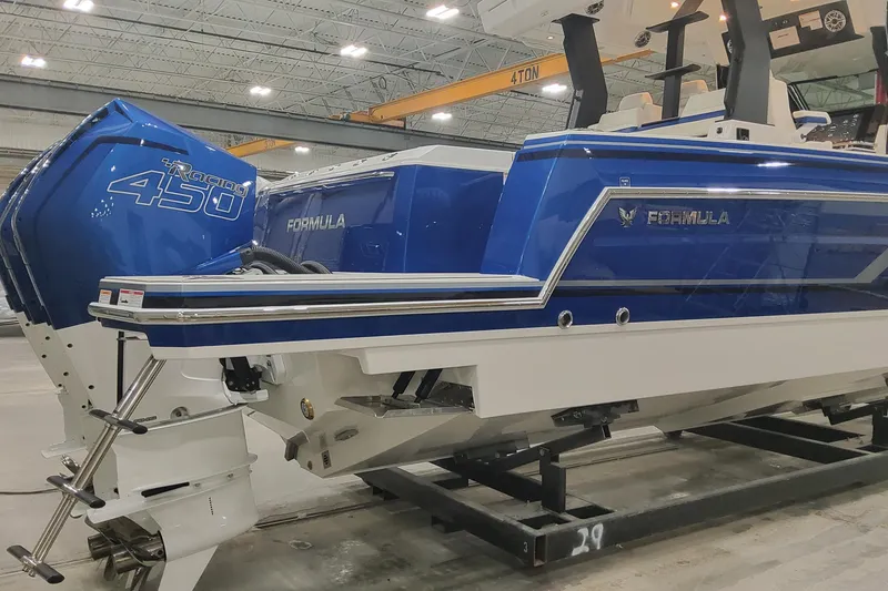 Slide: The Image of 2024 Formula 387 Center Console Fish boat with blue exterior and powerful engines. - 10