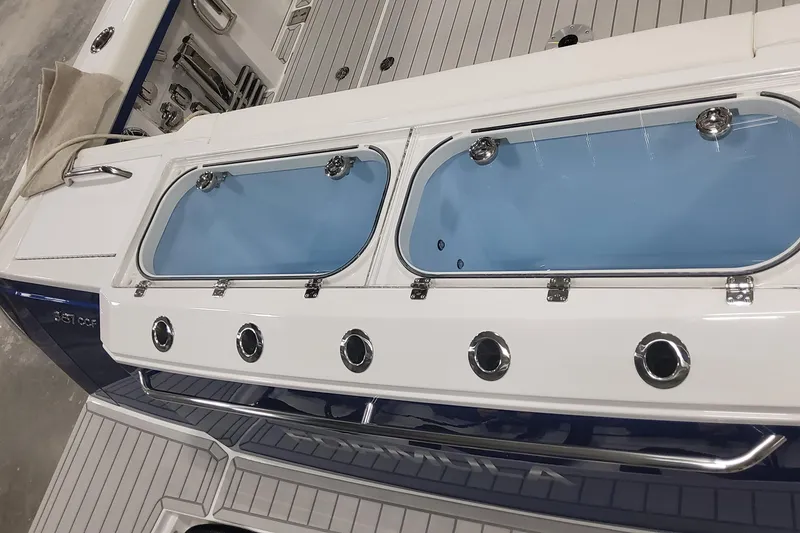 Slide: The Image of 2024 Formula 387 Center Console Fish boat with sleek deck and storage compartments. - 12