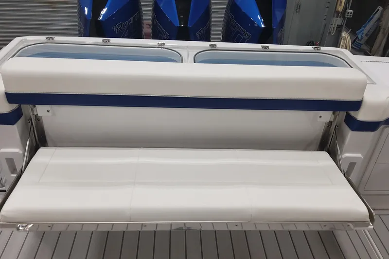 Slide: The Image of 2024 Formula 387 Center Console Fish boat with white and blue seating. - 16