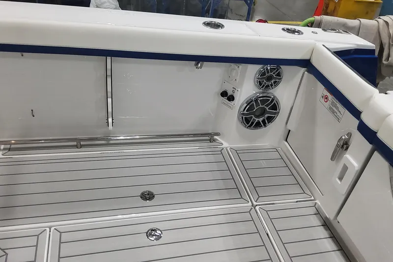 Slide: The Image of 2024 Formula 387 Center Console Fish boat interior with speakers and sleek flooring. - 20