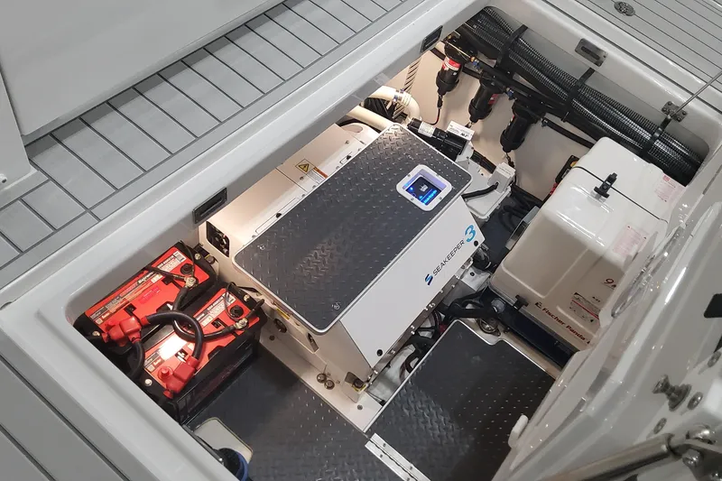 Slide: The Image of 2024 Formula 387 Center Console Fish engine compartment with Seakeeper 3 and batteries. - 23
