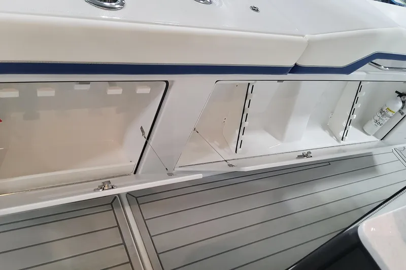 Slide: The Image of 2024 Formula 387 Center Console Fish boat storage compartments and deck view. - 29