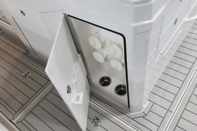 Slide: The Image of 2024 Formula 387 Center Console Fish boat storage compartment with open door. - 30