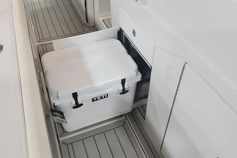 Slide: The Image of 2024 Formula 387 Center Console Fish with Yeti cooler storage compartment. - 31