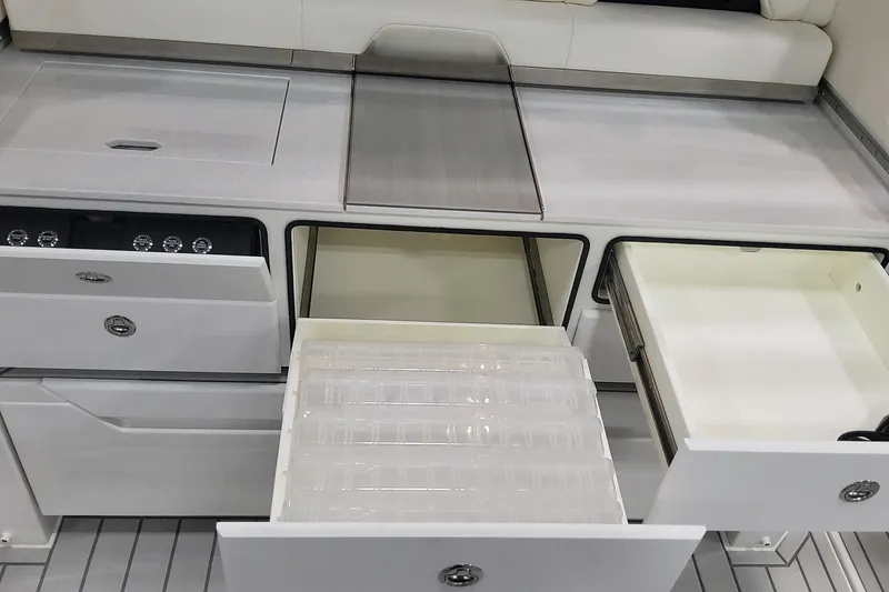 Slide: The Image of 2024 Formula 387 Center Console Fish boat interior with open storage compartments. - 32