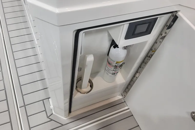 Slide: The Image of 2024 Formula 387 Center Console Fish storage compartment with fire extinguisher. - 33