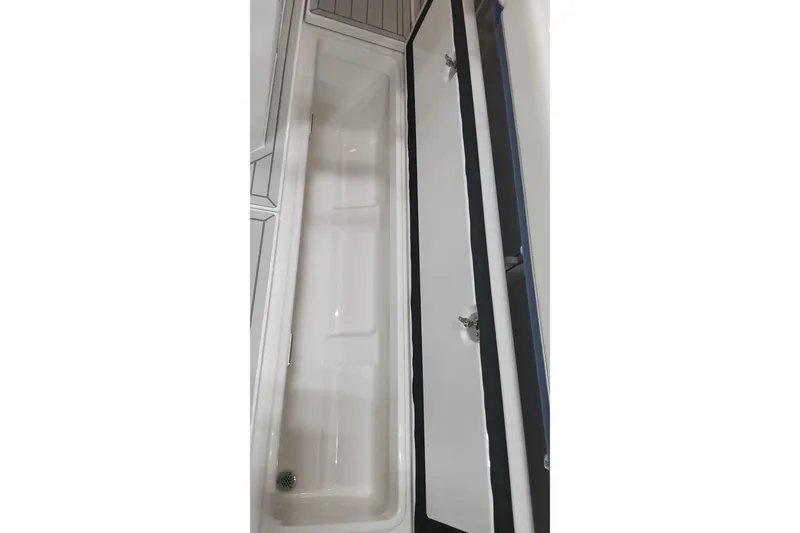 Slide: The Image of 2024 Formula 387 Center Console Fish storage compartment, open view. - 35