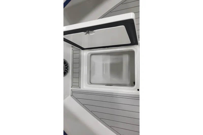 Slide: The Image of 2024 Formula 387 Center Console Fish boat storage compartment open, showcasing interior design. - 44