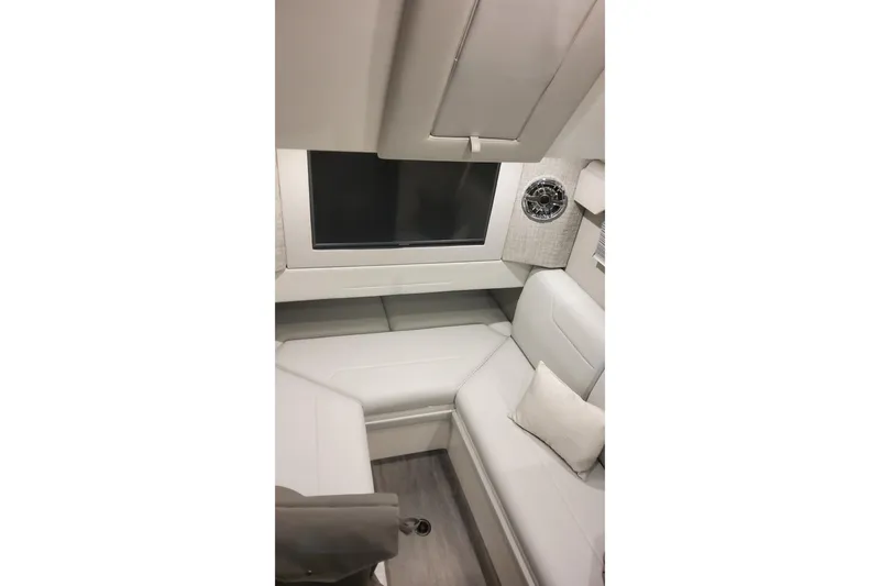 Slide: The Image of 2024 Formula 387 Center Console Fish cabin interior with modern seating and entertainment system. - 54