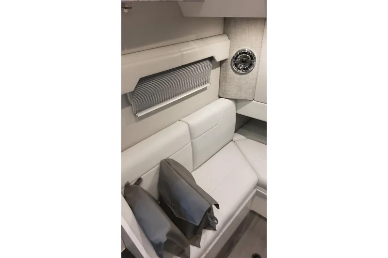 Slide: The Image of 2024 Formula 387 Center Console Fish interior with white seating and decorative pillows. - 55