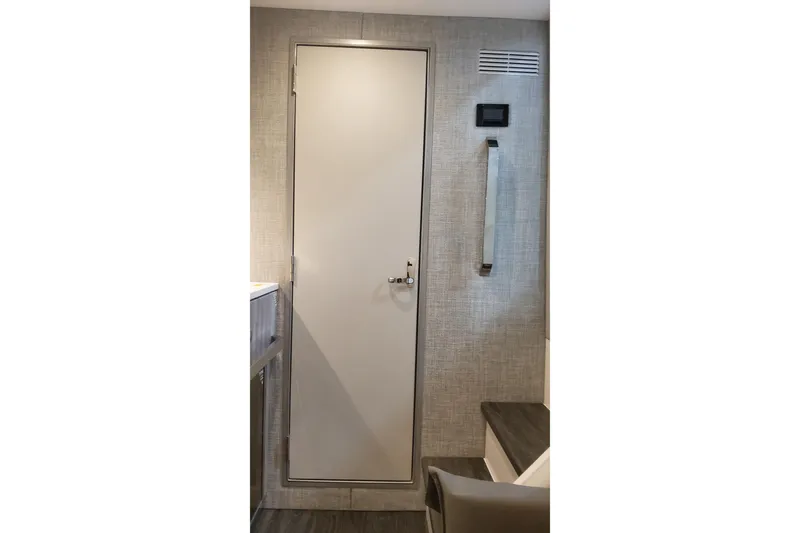 Slide: The Image of Interior cabin door of 2024 Formula 387 Center Console Fish boat. - 59