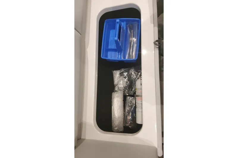 Slide: The Image of Storage compartment in 2024 Formula 387 Center Console Fish boat with organized tools. - 63