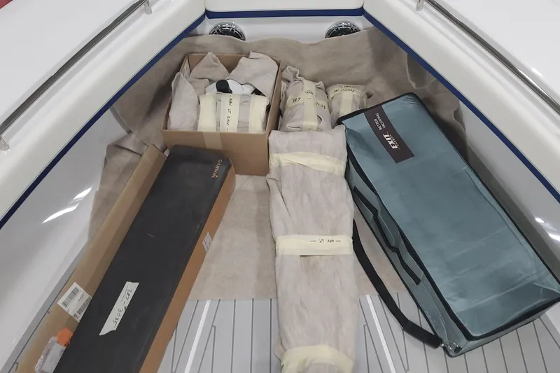 Slide: The Image of 2024 Formula 387 Center Console Fish boat storage area with packaged equipment. - 65