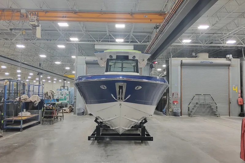 Slide: The Image of 2024 Formula 387 Center Console Fish boat in a manufacturing facility. - 7