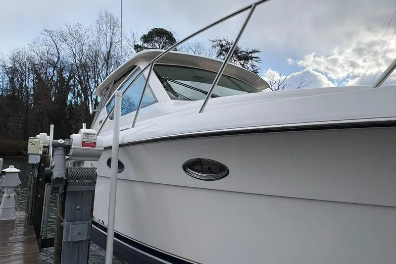 Slide: The Image of 2008 Tiara Yachts 3000 Open docked, showcasing sleek design and sturdy build. - 10