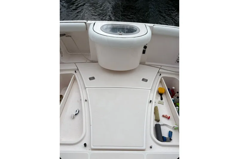 Slide: The Image of 2008 Tiara Yachts 3000 Open deck with storage compartments and fishing equipment. - 12