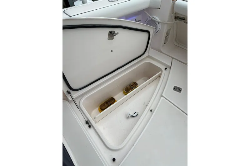 Slide: The Image of Storage compartment on a 2008 Tiara Yachts 3000 Open boat, featuring organized interior space. - 14