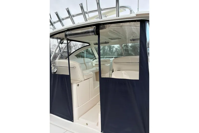 Slide: The Image of 2008 Tiara Yachts 3000 Open interior with seating and protective cover. - 15