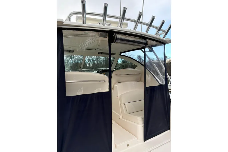 Slide: The Image of 2008 Tiara Yachts 3000 Open interior with seating and protective cover. - 18