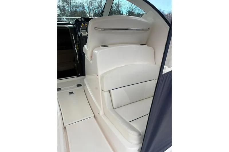 Slide: The Image of 2008 Tiara Yachts 3000 Open interior seating, featuring white leather upholstery. - 20