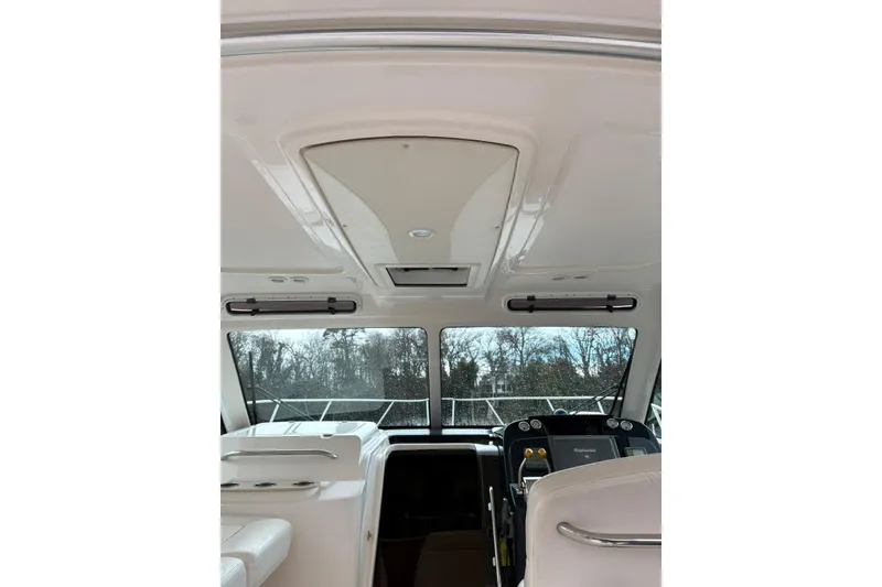 Slide: The Image of Interior view of 2008 Tiara Yachts 3000 Open, showcasing helm and seating area. - 22