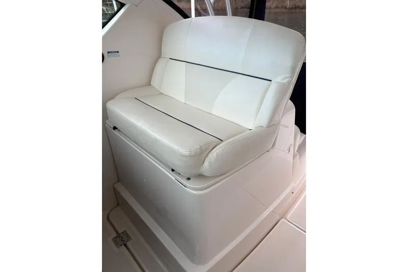 Slide: The Image of White cushioned seat on 2008 Tiara Yachts 3000 Open boat interior. - 24