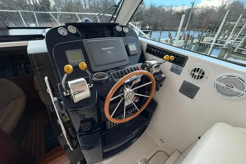 Slide: The Image of Helm of 2008 Tiara Yachts 3000 Open with Raymarine navigation system. - 27
