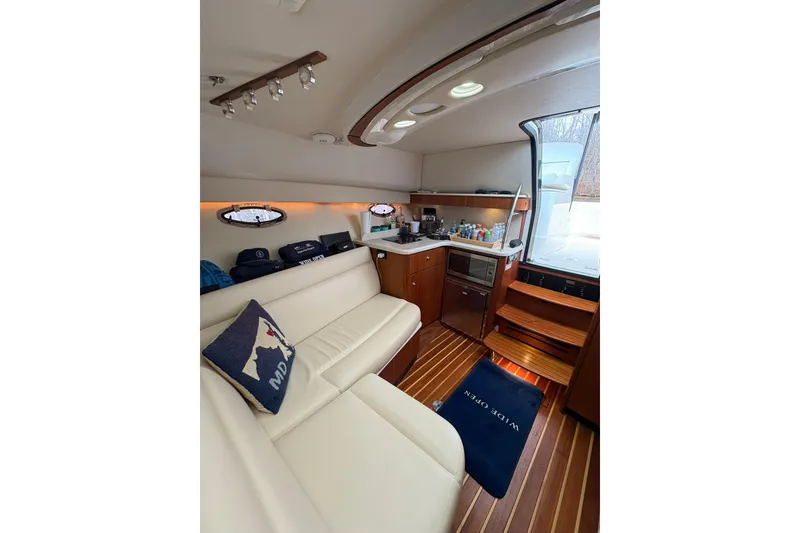 Slide: The Image of 2008 Tiara Yachts 3000 Open interior with cozy seating and kitchenette. - 34