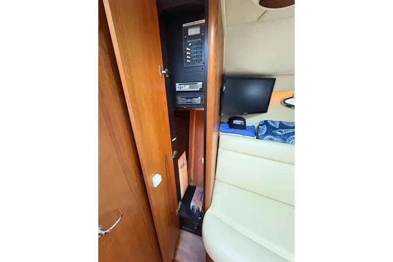 Slide: The Image of 2008 Tiara Yachts 3000 Open interior with control panel and seating area. - 37