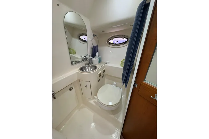 Slide: The Image of 2008 Tiara Yachts 3000 Open bathroom with sink, toilet, and mirror. - 39