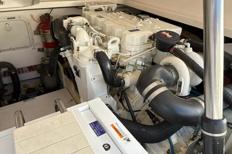 Slide: The Image of Engine compartment of a 2008 Tiara Yachts 3000 Open, showcasing detailed machinery. - 46