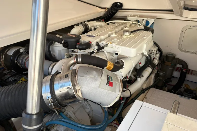 Slide: The Image of Engine compartment of a 2008 Tiara Yachts 3000 Open, showcasing detailed machinery. - 47