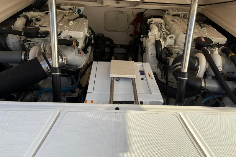 Slide: The Image of Engine compartment of a 2008 Tiara Yachts 3000 Open, showcasing dual engines and equipment. - 50