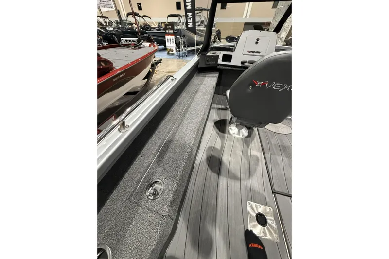 Slide: The Image of 2026 Vexus ADX 190 boat interior with sleek seating and modern dashboard. - 12