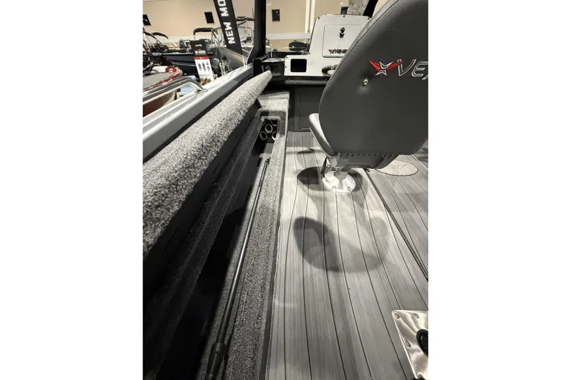 Slide: The Image of 2026 Vexus ADX 190 boat interior with seating and storage compartments. - 13