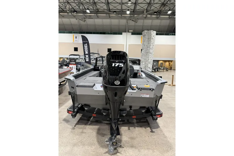 Slide: The Image of 2026 Vexus ADX 190 boat with 175 horsepower engine displayed indoors. - 4