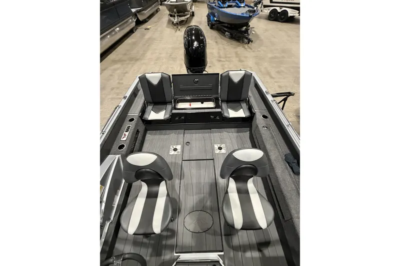 Slide: The Image of 2026 Vexus ADX 190 boat interior with gray seating and modern design. - 7