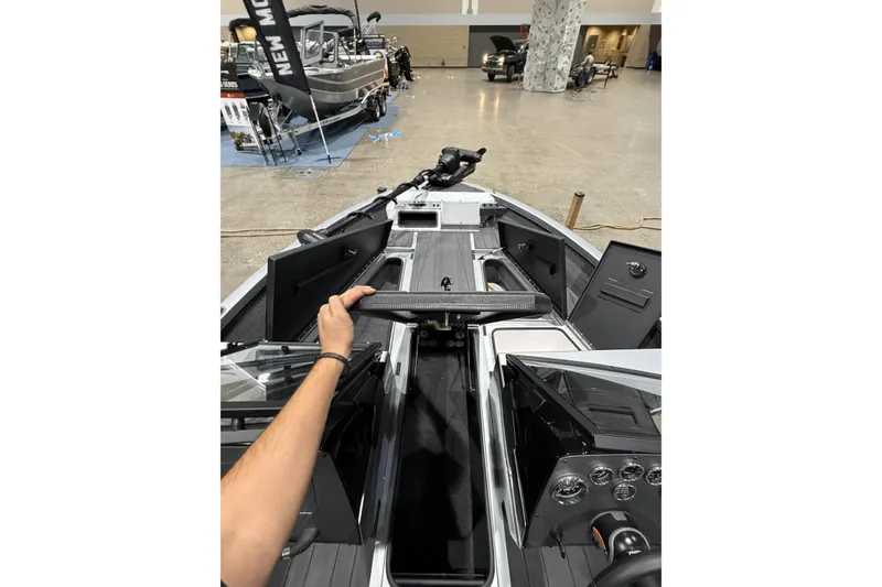 Slide: The Image of Interior view of 2026 Vexus ADX 190 boat at a showroom display. - 9