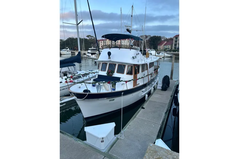 Slide: The Image of 1979 Cheoy Lee 46 LRC yacht for sale, docked at marina. - 1