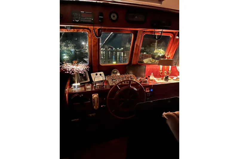 Slide: The Image of 1979 Cheoy Lee 46 LRC yacht interior with vintage helm and nautical decor. - 13