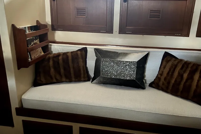 Slide: The Image of Interior of 1979 Cheoy Lee 46 LRC yacht with plush cushions and wooden cabinetry. - 17