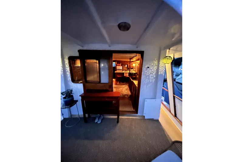 Slide: The Image of 1979 Cheoy Lee 46 LRC yacht interior view with warm lighting and cozy decor. - 18