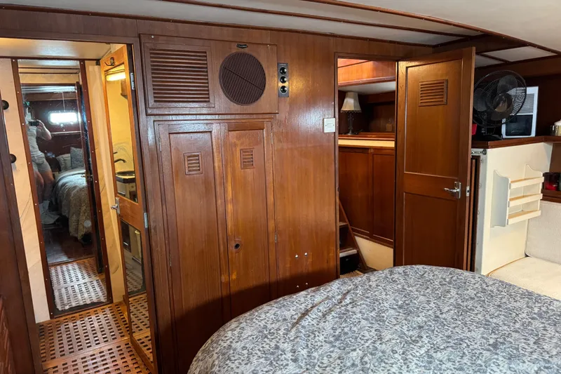 Slide: The Image of Interior of 1979 Cheoy Lee 46 LRC yacht with wooden cabinetry and cozy furnishings. - 25