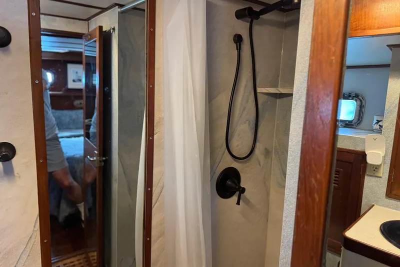 Slide: The Image of 1979 Cheoy Lee 46 LRC yacht interior with shower and cabin view. - 26