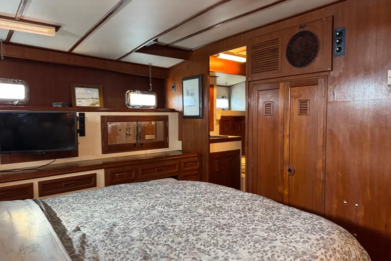 Slide: The Image of Interior of 1979 Cheoy Lee 46 LRC yacht with wood paneling and cozy furnishings. - 28