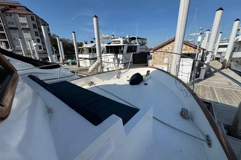 Slide: The Image of 1979 Cheoy Lee 46 LRC yacht docked at marina under clear blue sky. - 34
