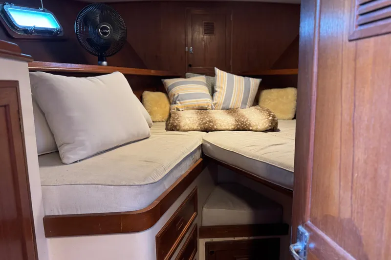 Slide: The Image of Cozy cabin interior of 1979 Cheoy Lee 46 LRC with plush bedding and wooden accents. - 35