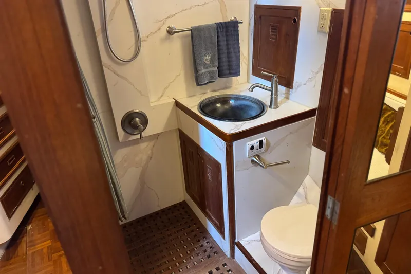 Slide: The Image of Bathroom interior of 1979 Cheoy Lee 46 LRC yacht with sink and toilet. - 37